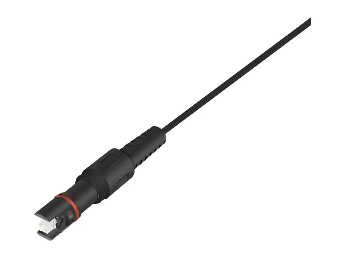 Black IP68 hardened SC/APC outdoor connector assembly with the white ceramic ferrule tip visible at the coupling and a threaded weatherproof body on a black cable