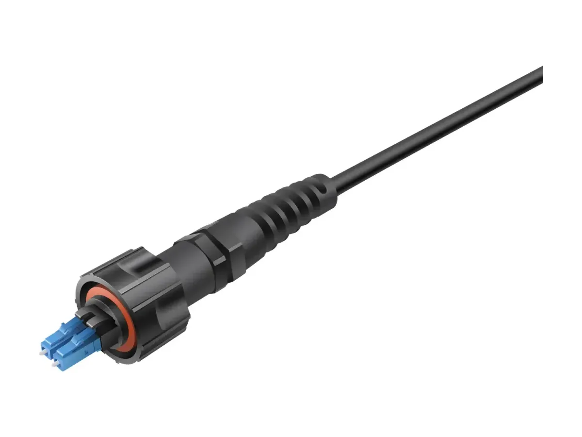 Outdoor fiber optic connector with an orange face seal and duplex LC ferrules, the sealing ring that keeps moisture out of a tower top connection