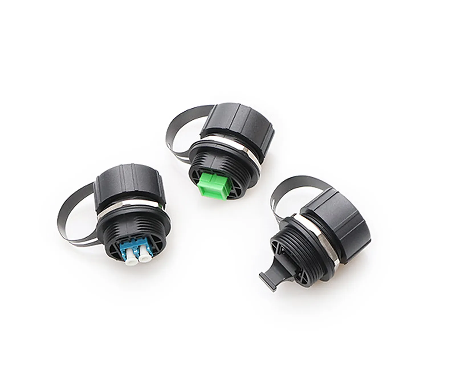 Three sealed bulkhead adapters, one open to show the green single-mode APC duplex adapter insert inside the housing